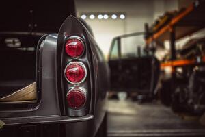 Classic cars being restored in a vintage vehicle garage workshop photo
