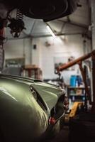 Classic cars being restored in a vintage vehicle garage workshop photo