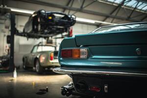Classic cars being restored in a vintage vehicle garage workshop photo