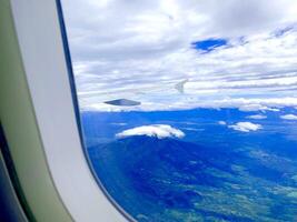 Dramatic Cloud and mountain View From airplane window photo
