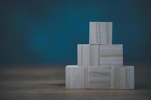 A stack of wooden blocks on a table photo