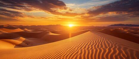 Endless sand dunes at sunset, with deep shadows and glowing orange skies photo
