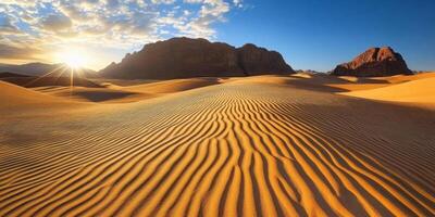 Rippled sand patterns leading towards towering dunes, soft sunlight photo