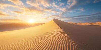 Rippled sand patterns leading towards towering dunes, soft sunlight photo