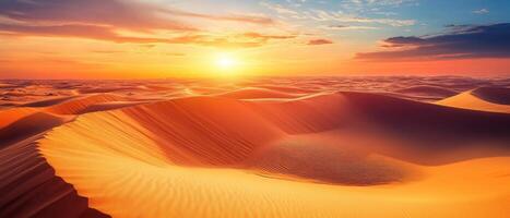 Endless sand dunes at sunset, with deep shadows and glowing orange skies photo