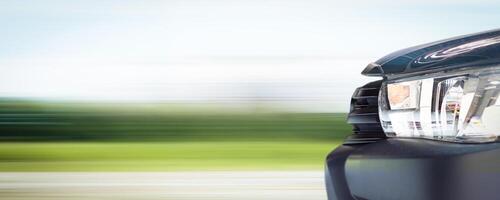 Fast driving , car moving at speed with blurred landscape background , horizontal banner with copy space for text decoration photo