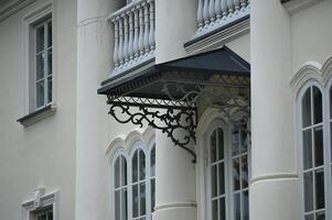 a white building with a balcony photo
