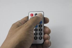 isolated left hand holding remote photo