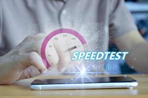 fast internet connection speedtest network bandwidth technology Man using high speed internet with smartphone and laptop computer. 5G quality, speed optimization. photo