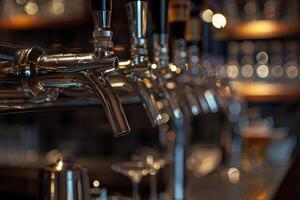 Row of shiny beer taps in empty bar waiting for customers photo