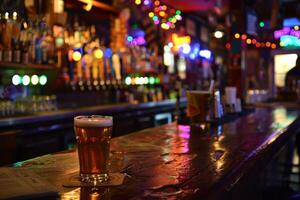 Glass of beer resting on bar top in busy pub photo