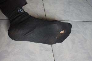 socks with holes in the soles photo
