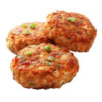 Delicious golden brown crab cakes garnished with green onion on white background photo