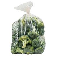 Plastic bag full of fresh broccoli isolated on white background photo