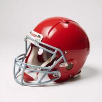 Red American football helmet against plain white backdrop photo