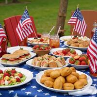 Festive picnic featuring American flagthemed decorations food and beverages photo