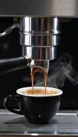 Fresh espresso being poured from an appliance by a coffee maker photo