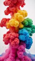 A vibrant rainbowcolored paint explosion featuring swirling fumes and dynamic movement resembling a liquid ink dyed in water photo