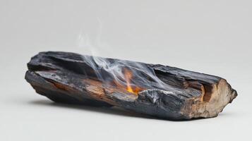 A log with smoke coming out of it photo