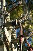 a close up of a power pole with wires attached photo
