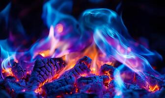 A close-up of blue and purple flames burning in a fireplace. photo