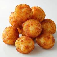 araffy pile of cheese balls on a white plate photo