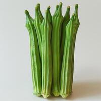 five green oklery stalks on a white surface photo