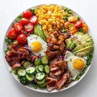 a close up of a plate of food with eggs, bacon, tomatoes, cucumbers, and corn photo