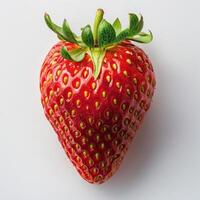 araffe strawberry with green leaves on white surface with white background photo