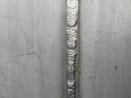Stainless Steel Welding Seam Close-up image of a precise and expertly executed welding seam on a stainless steel surface, showcasing the intricate detail of the weld. photo