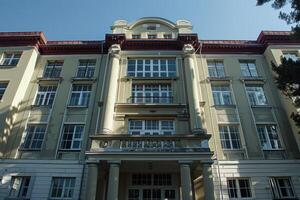 Old european university building facade with columns photo