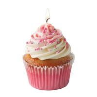 Delicious cupcake decorated with icing and sprinkles holding a lit candle photo