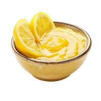 Bowl containing lemon curd with lemon slices on white background photo