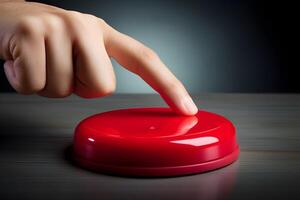 A hand presses a red button against a dark background, symbolizing the nuclear strike concept, evoking tension, authority, and the grave consequences of such an action. photo