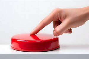 A hand presses a red button on a white background, symbolizing the nuclear strike concept, highlighting tension, danger, and the critical decision-making involved. photo