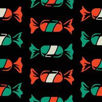 A pattern with candy on black background vector