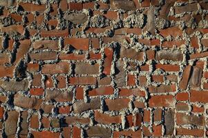 a brick wall with many different colors photo