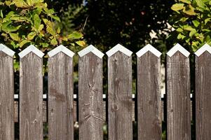 a wooden fence with a white picket photo