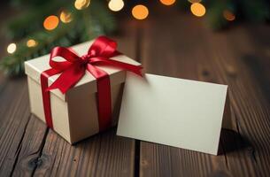 Gift Box with Red Ribbon and Blank Card on Wooden Table, Festive Christmas Lights in Background. Perfect for Holiday Themes photo