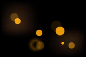 Defocused golden bokeh. Shiny lights on black background. Light effect. vector