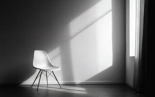 A lone white modern chair stands in an empty room, dramatic shadows cast by sunlight streaming through a window, embodying minimalist design and simplicity photo