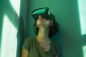 Anxiety and side effects of VR. Woman is leaning against the wall in the corner of the room, wearing a virtual reality headset, experiencing fear and vertigo of VR experience. photo