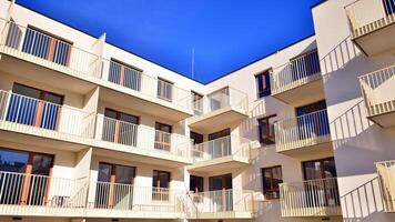 Modern apartment buildings on a sunny day with a blue sky. Facade of a modern apartment building. photo