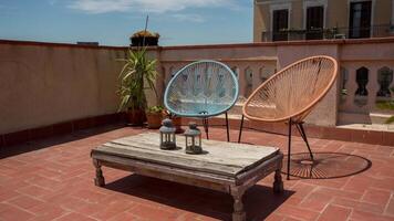 A patio with a table and chairs video