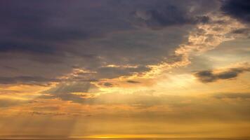Sunbeams shining through clouds over the ocean video