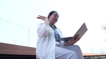 Asian fat woman with a bright face goes about her daily life, eating and walking happily. In the city and in buildings video