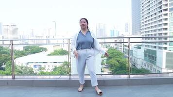 Asian fat woman with a bright face goes about her daily life, eating and walking happily. In the city and in buildings video