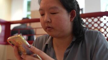 Asian fat woman with a bright face goes about her daily life, eating and walking happily. In the city and in buildings video
