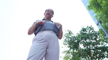 Asian fat woman with a bright face goes about her daily life, eating and walking happily. In the city and in buildings video