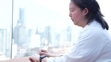 Asian fat woman with a bright face goes about her daily life, eating and walking happily. In the city and in buildings video